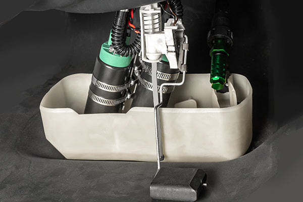 Close-up of a mechanical device with green and black components on a dark background